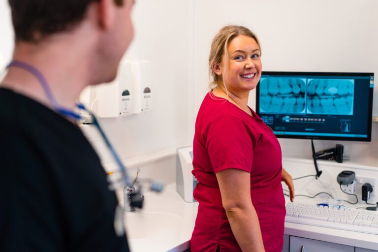 Pure Dental Woman In Red With Monitor Screen