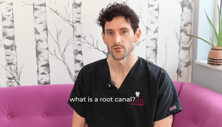 Graham a dentist at Pure Dental Health with the lext 'what is a root canal?'.