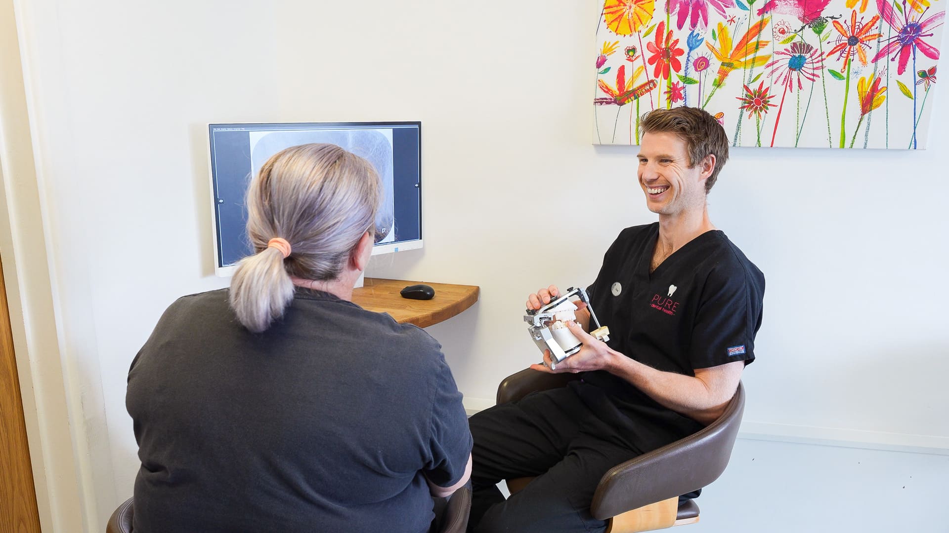 Pure Dental Consultation Smiling With Patient