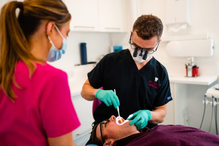 Pure Dental Dentist Examining Patients Teeth