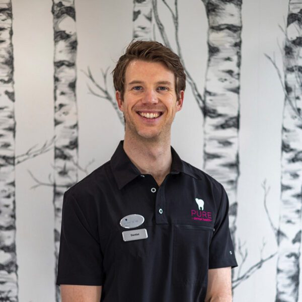 A headshot of dentist Conor O’Kane at Pure Dental.