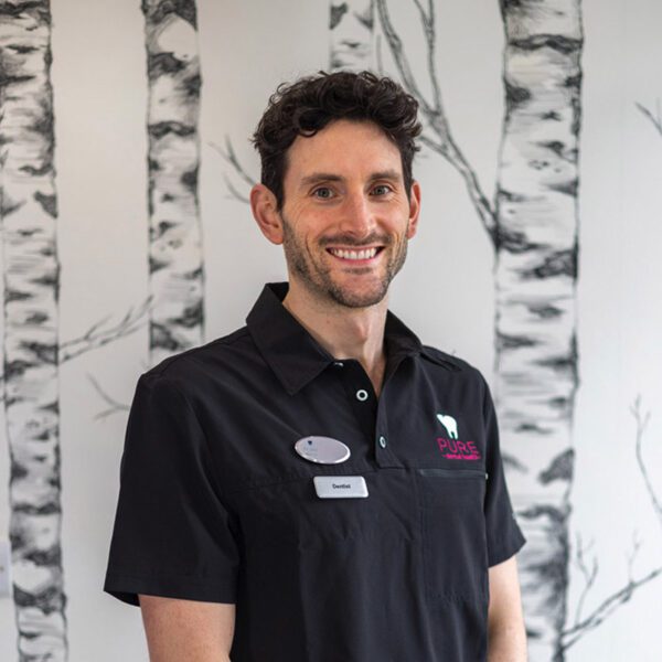 A headshot of dentist Graham Campbell at Pure Dental.