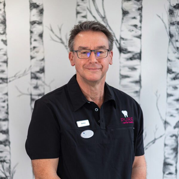 A headshot of dentist Mike Bassett-Cross at Pure Dental.