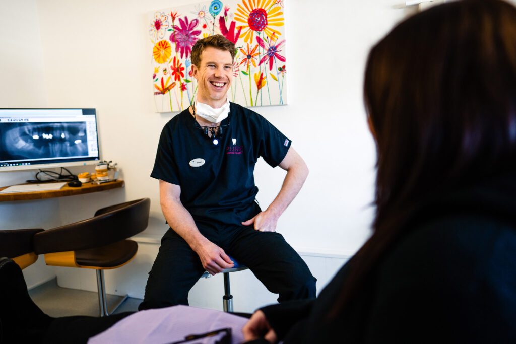 Pure Dental Smiling Dentist